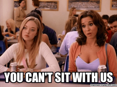 Image of two girls at a table from the movie "Mean Girls" with text that says you can't sit with us. 